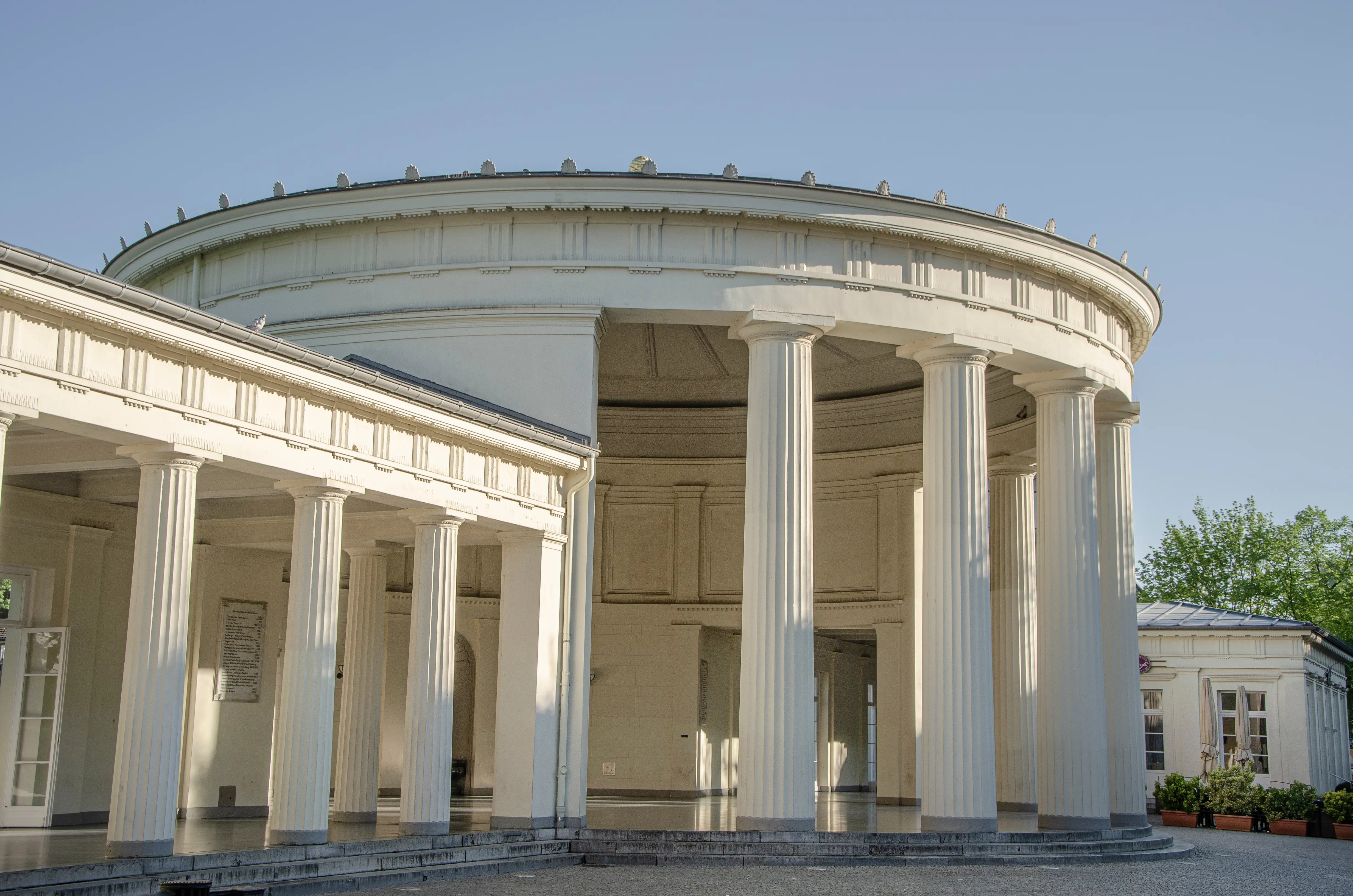 A white circular building with classicial columns