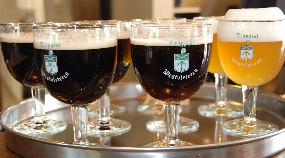 A tray full of glasses of Westvleteren beer.