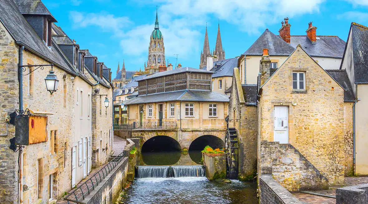 Picturesque French village with bridge over river