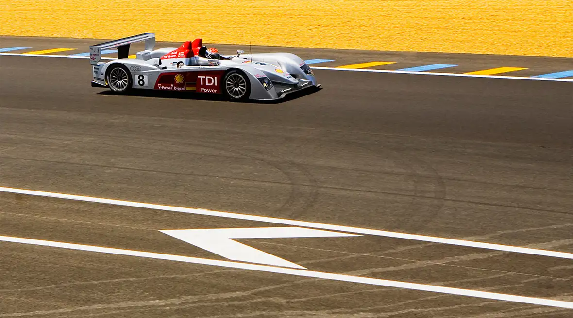 grey sports car on a racing track