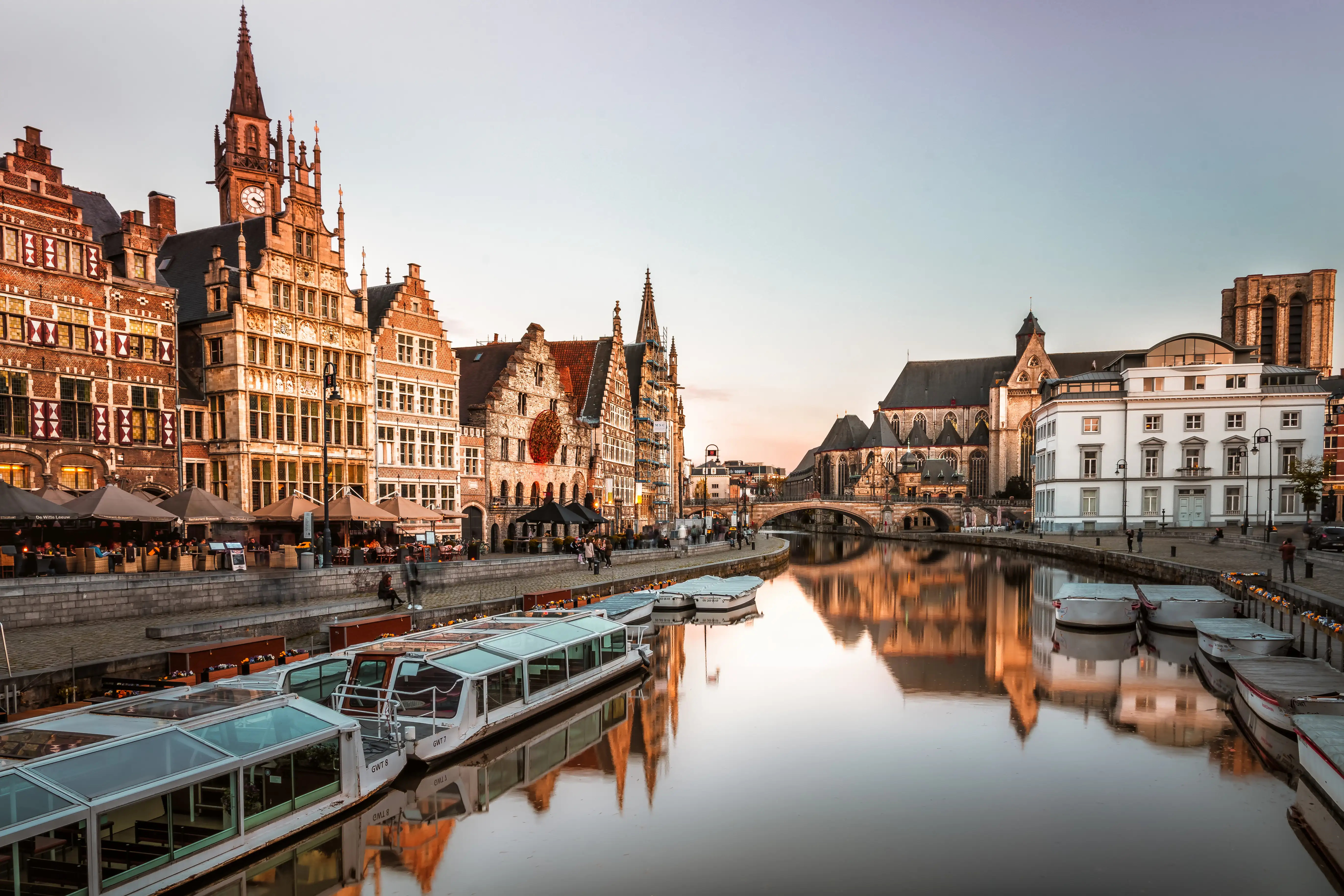 Attractive old buildings lining a river in a European city on an autumn or winter’s afternoon